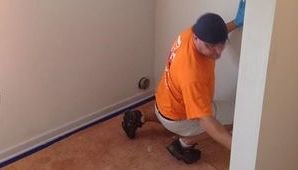 Mold Cleanup Technician On The Job