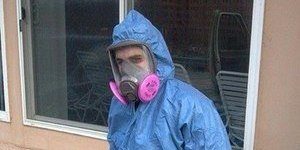 Technician With Mold Removal Gear and Tools